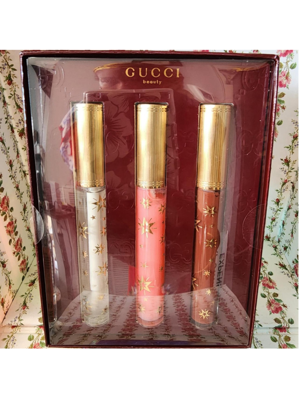 Gucci Beauty Lip Gloss Set with gold star patterns on clear tubes #luxury #lipgl